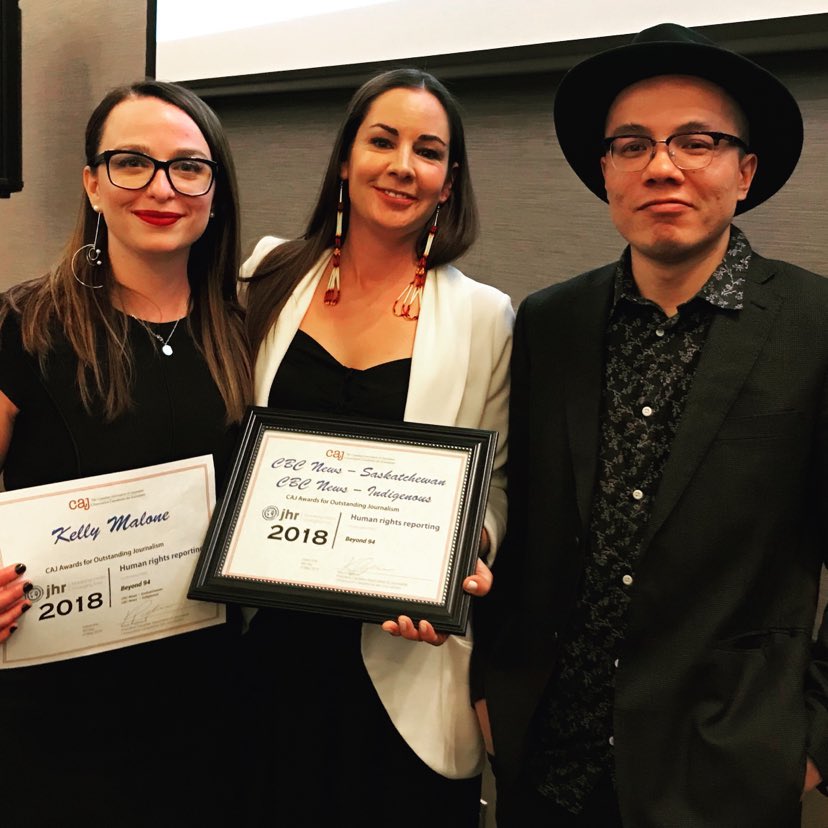 Picture of Kelly Malone and others holding awards for the article called Professionalism, respect, and self-care; the tightrope walk of trauma reporting